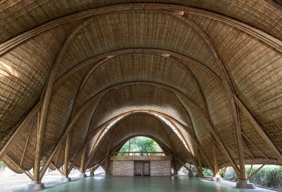 There is a brick structure within the bamboo canopy
