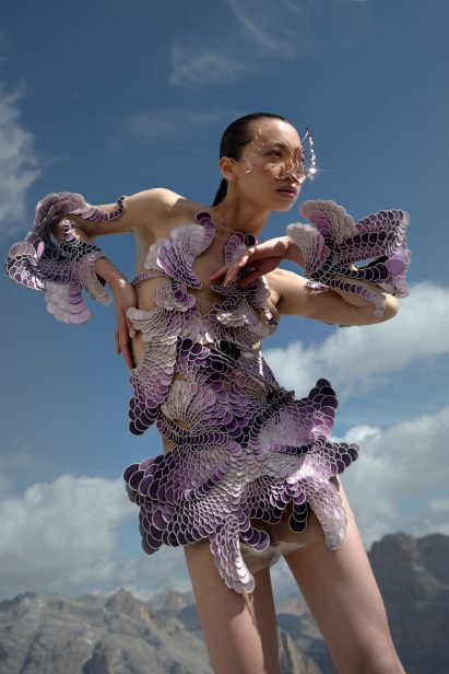 A woman wearing a purple dress from Earthrise