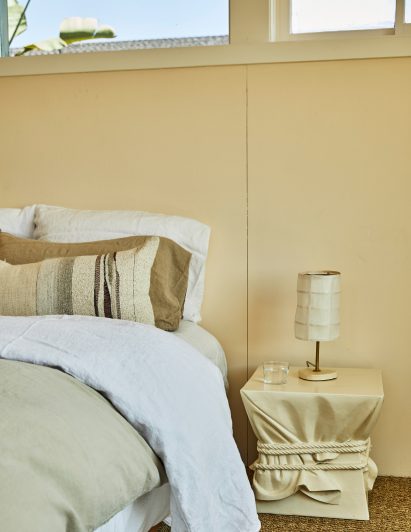 A bedroom in Malibu Surf Shack features light colours and casual decor