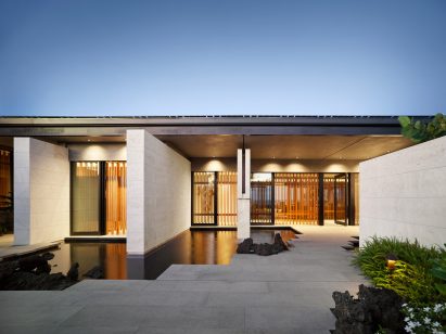 The villa has sliding architectural screens