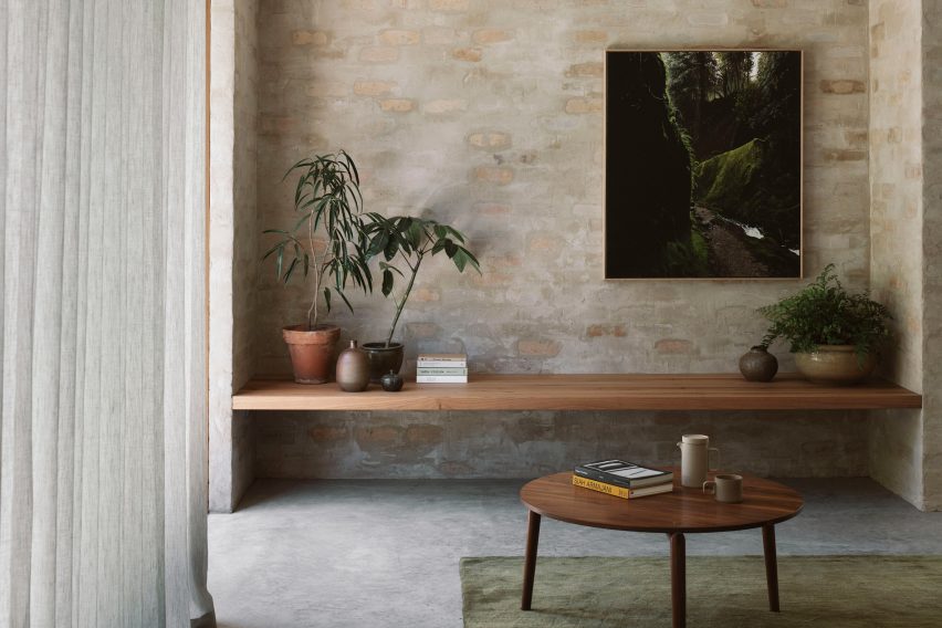 A living room with brick walls