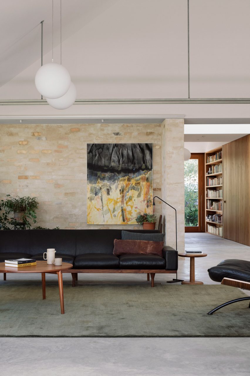 A living room with exposed brick walls