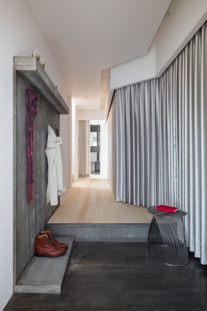 Silver curtains in hallway at Landscape House in Japan