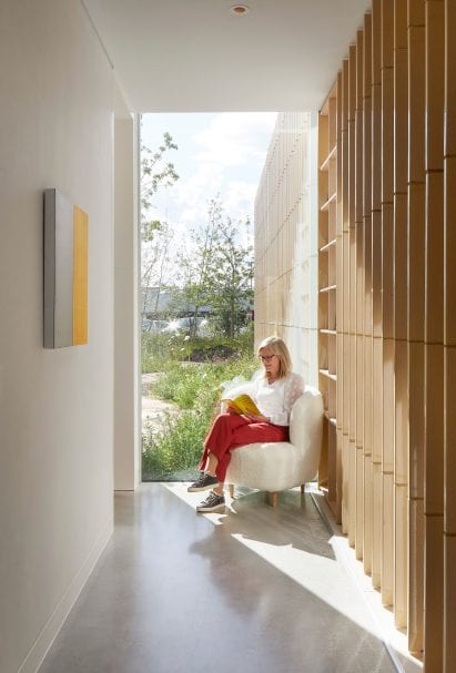 A white-walled corridor and seating area
