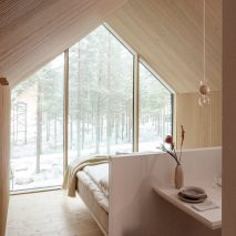 Wood lined cabin bedroom