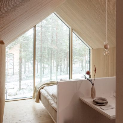 Wood lined cabin bedroom