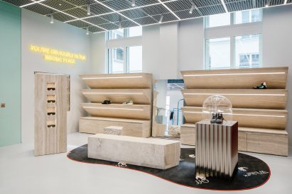 Travertine displays in retail interior by AMO