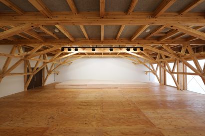 Wood panels cover the floors of the olympic village plaza