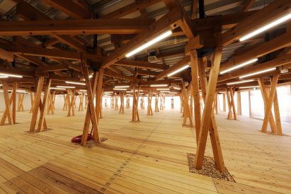 It has a latticed ceiling and support structure
