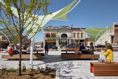 Picnic tables at a plaza in a park designed by Ross Barney Architects