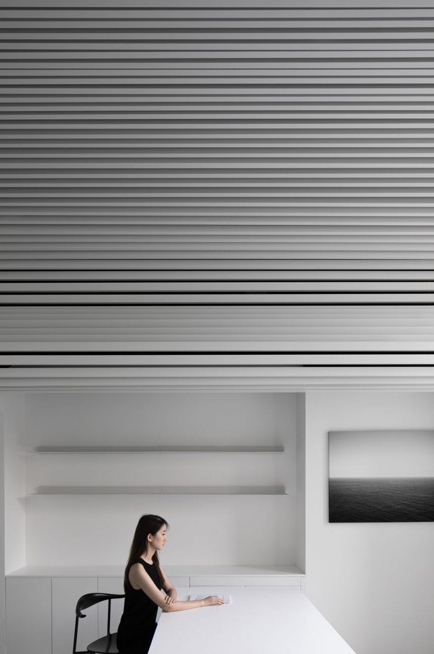 The undulating ceiling covers work spaces