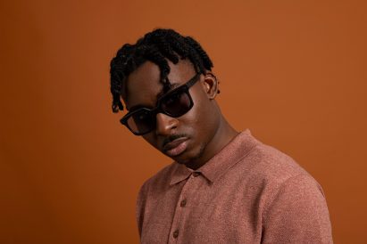A man wearing a square pair of black sunglasses