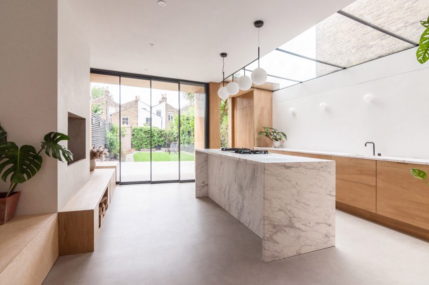 A white-walled kitchen with wooden joinery