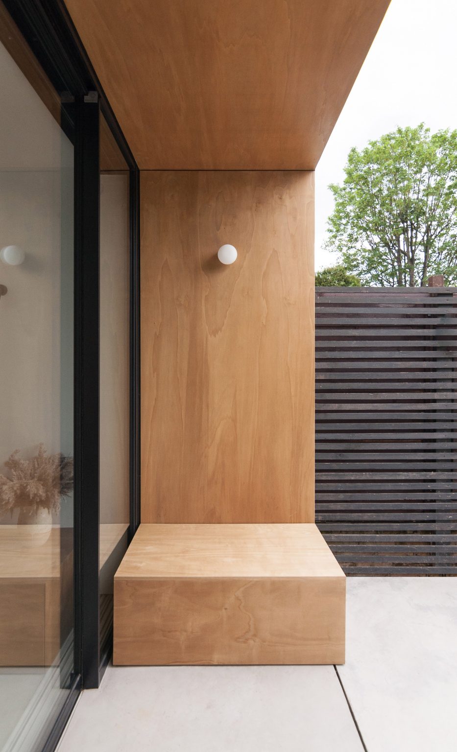 A sheltered wooden seat