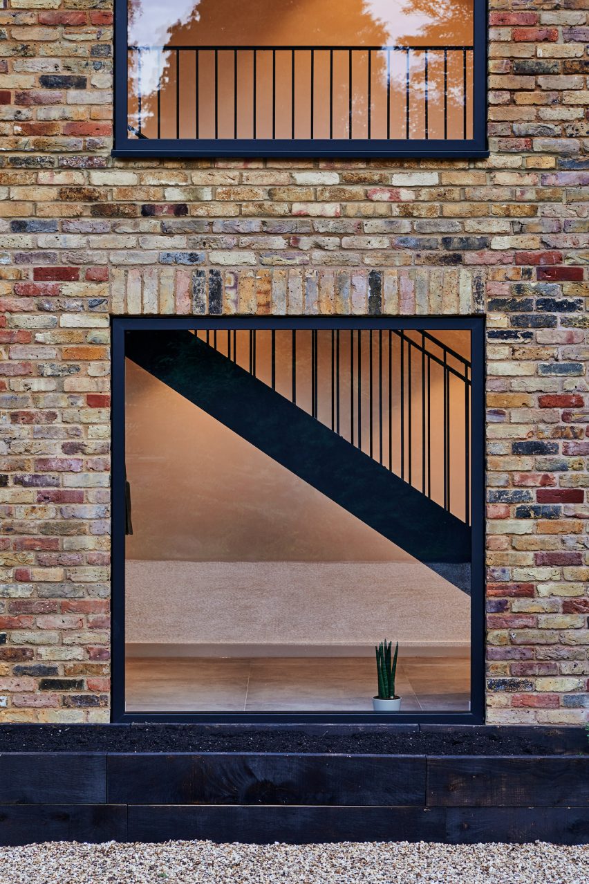 A brick house with large square windows