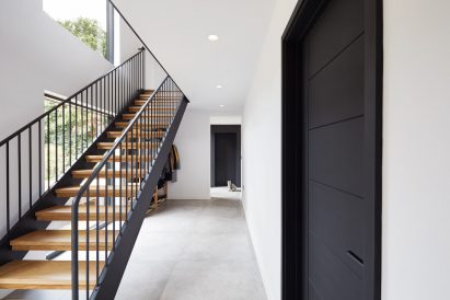 A wooden open-tread staircase
