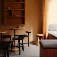 It has dark wood furnishings