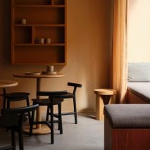 It has dark wood furnishings