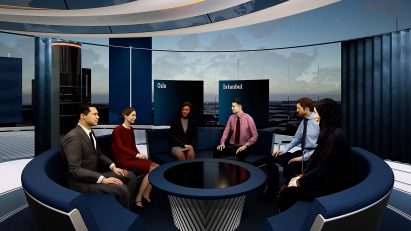 People sitting around a table in The News Pavillion