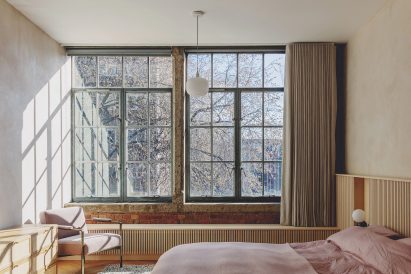 Main bedroom in St John Street warehouse apartment by Emil Eve Architects