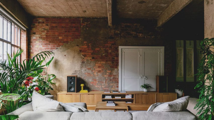 Lounge with custom sideboard in St John Street warehouse apartment by Emil Eve Architects