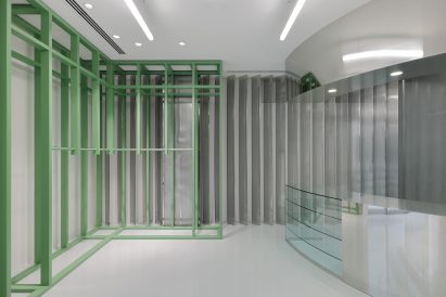 Green shelving and mirrored storage in Stüssy Shibuya store