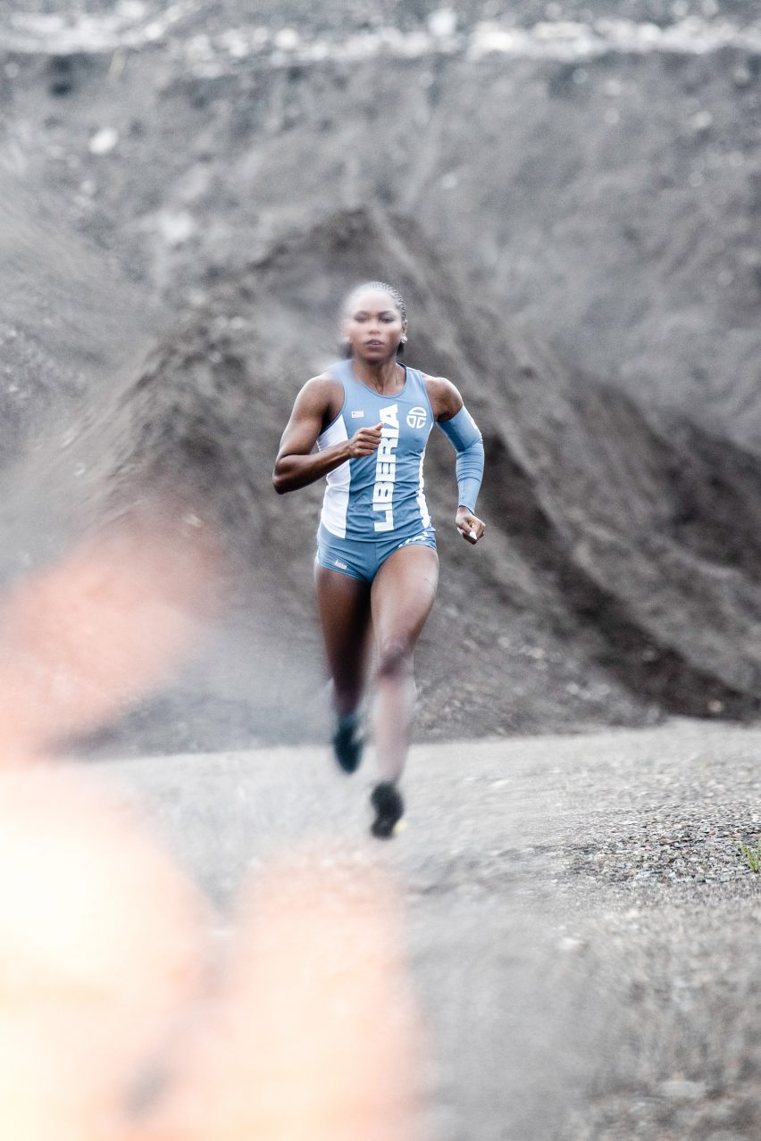 A female sprints in Telfar's Olympic uniform