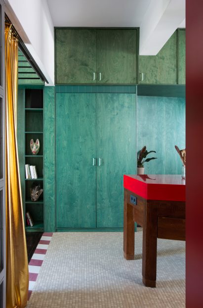Green built-in storage in interior by Point Supreme Architects
