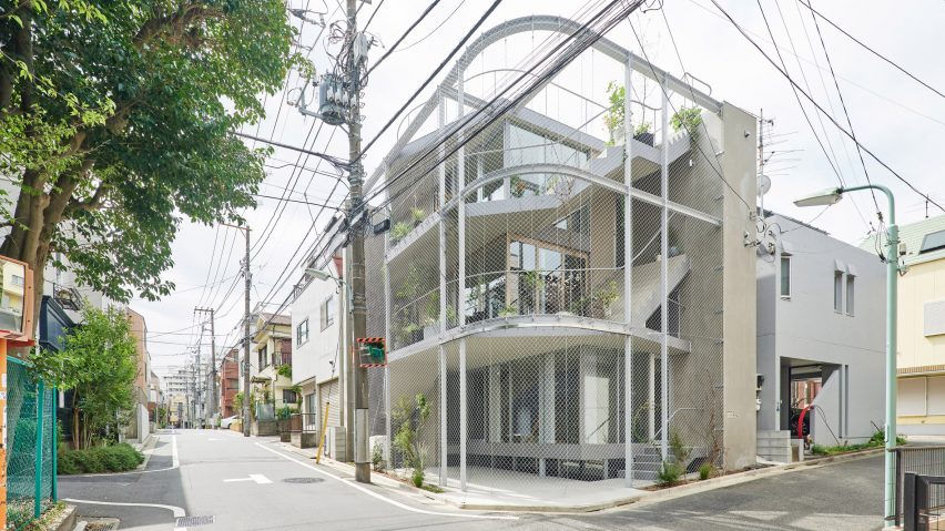 A Japanese house covered in metal mesh