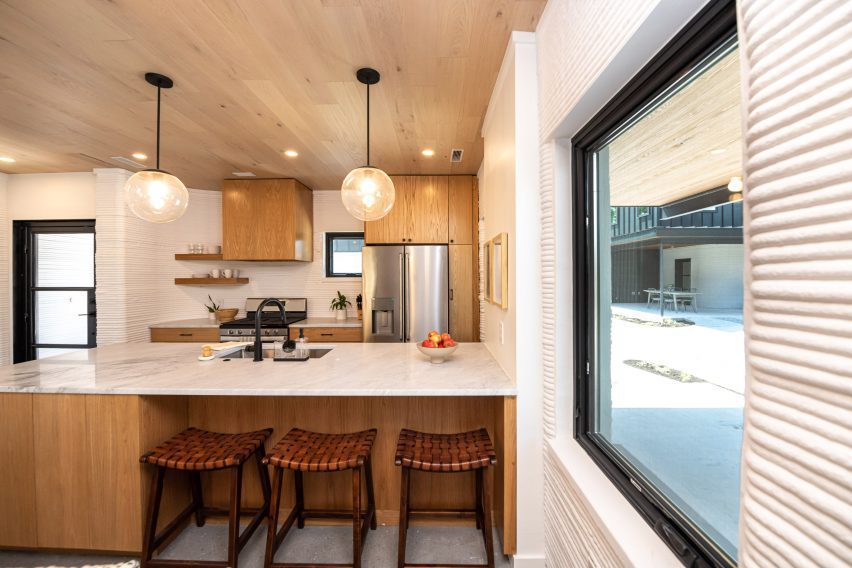 3D-printed walls are visible on the interior