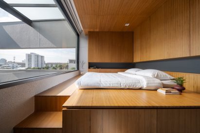 Bedroom of 55 Sathorn house by Kuanchanok Pakavaleetorn Architects