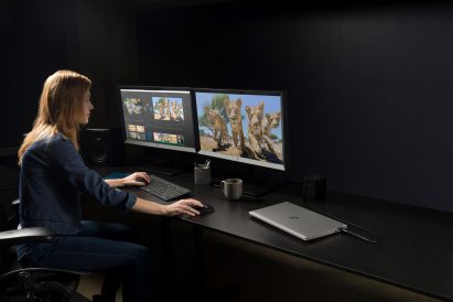 A photograph of a woman using a HP workstation