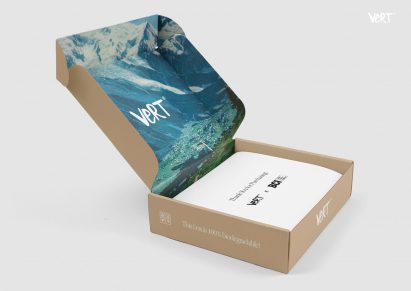 A cardboard box with a t shirt inside