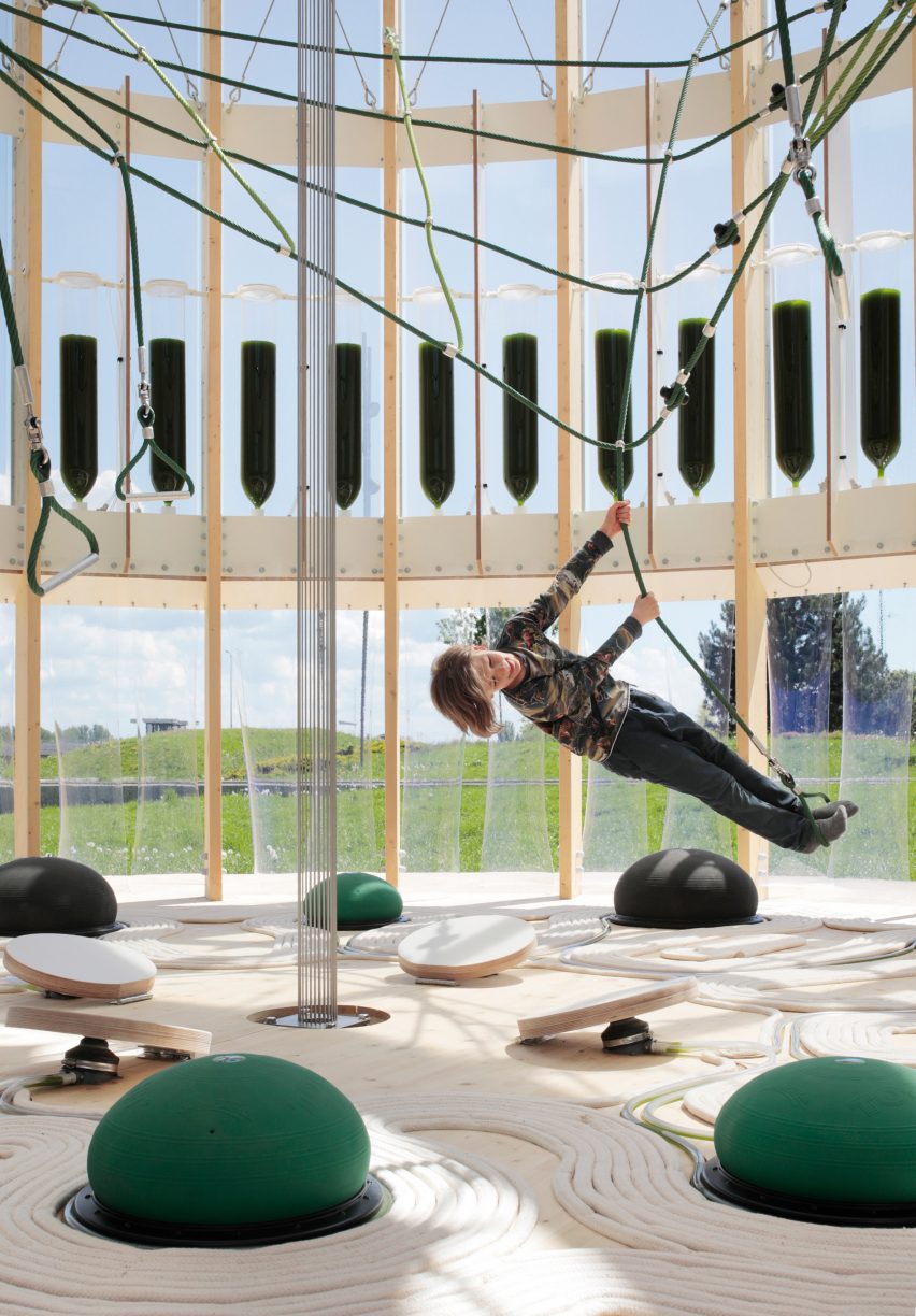 Child swinging on ropes inside the bioreactor playground