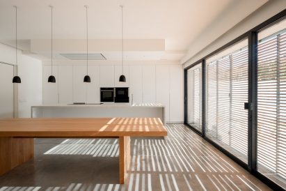 Light filters through the shutters at alaro house