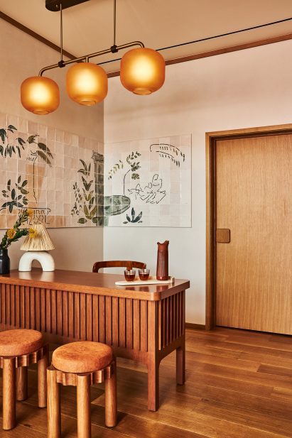 Reception area with tile mural at Alsace LA hotel