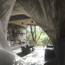 The living area has concrete walls