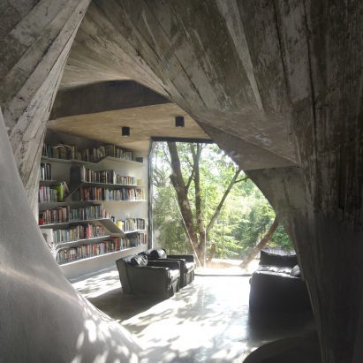 The living area has concrete walls