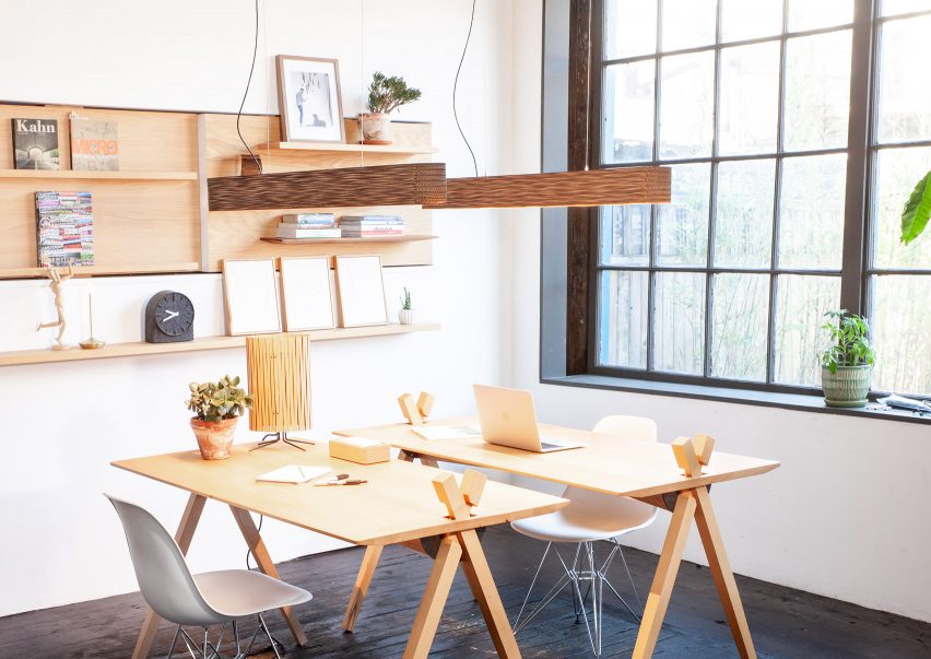 Dash Linear lighting by Graypants hangs over an office workbench