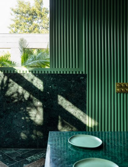 Green plates on a marble counter top