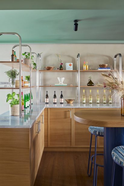 Wood and marble bar in hotel interior by Fettle