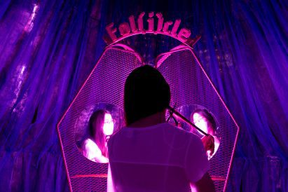 Partipant cuts off a hair sample for Follicle, a project by Pareid at Bangkok Design Week