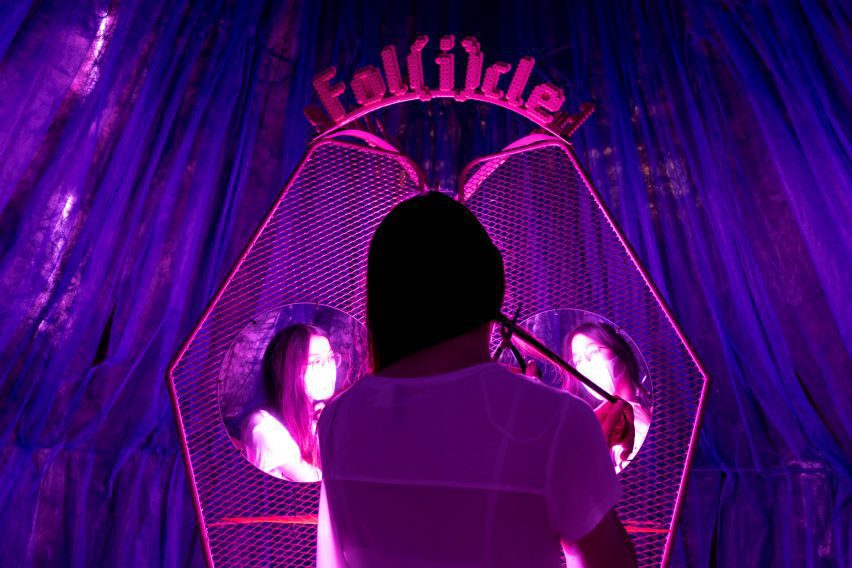 Partipant cuts off a hair sample for Follicle, a project by Pareid at Bangkok Design Week
