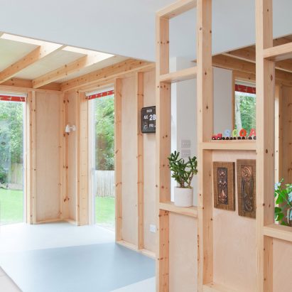A kitchen with wooden partitions