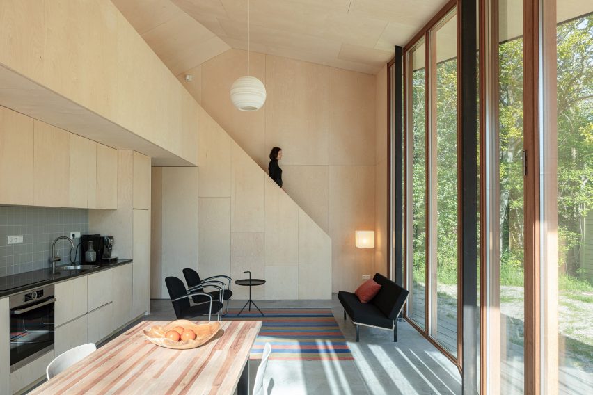 A woman walking downstairs in Holiday Home