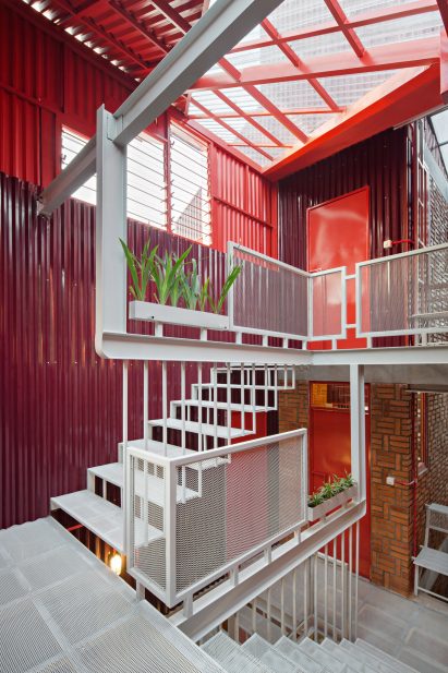 White sculptural staircase made of perforated steel