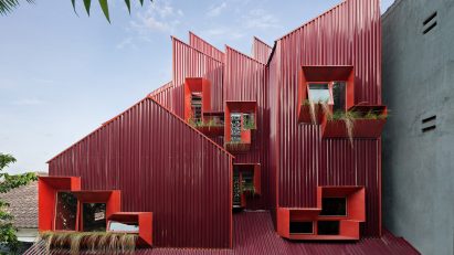 Exterior of Stack by Step Red Zone Boarding House by Ismail Solehudin Architecture
