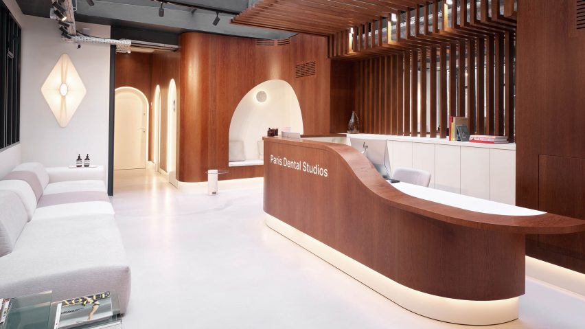 Lobby and oak reception desk inside Paris Dental Studios