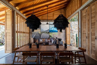 Wooden shutters flank this living room