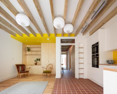 London-based studio Cottrell and Vermeulen Architecture added wooden cabinetry to this living room